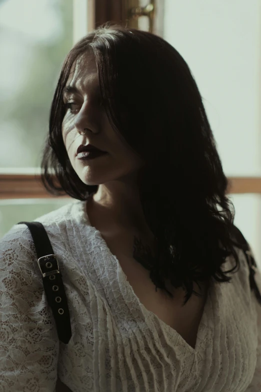 a woman with a white shirt and black bag