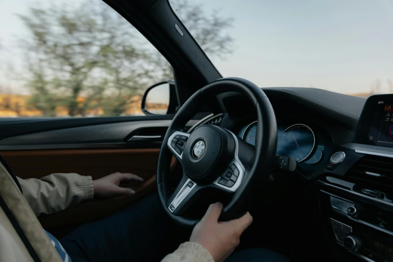 the driver behind the wheel of a new compact vehicle