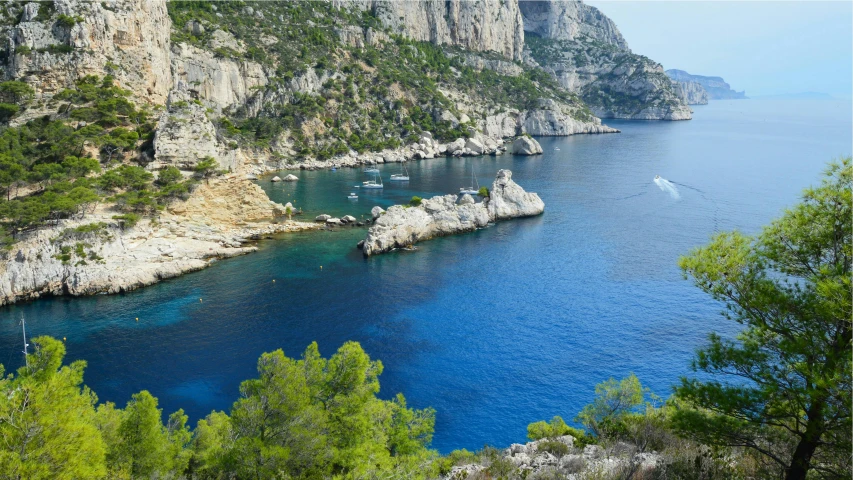 clear blue water on an island with rock formations