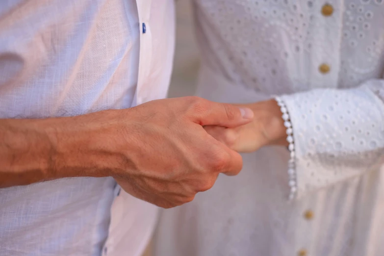 a person's hand holding another's hand