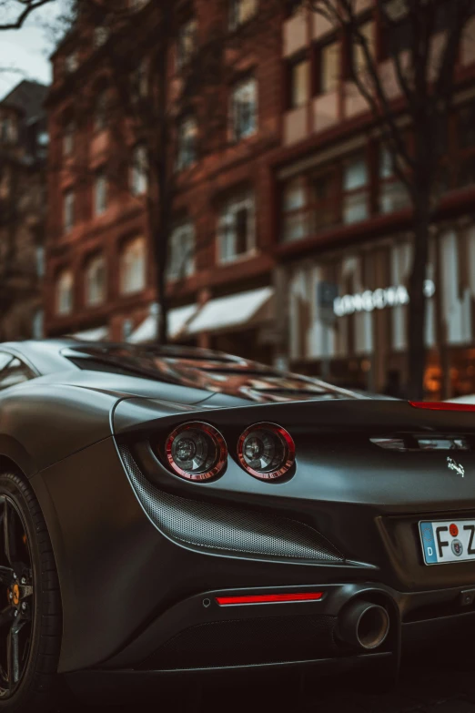 black sports car parked on the side of the road