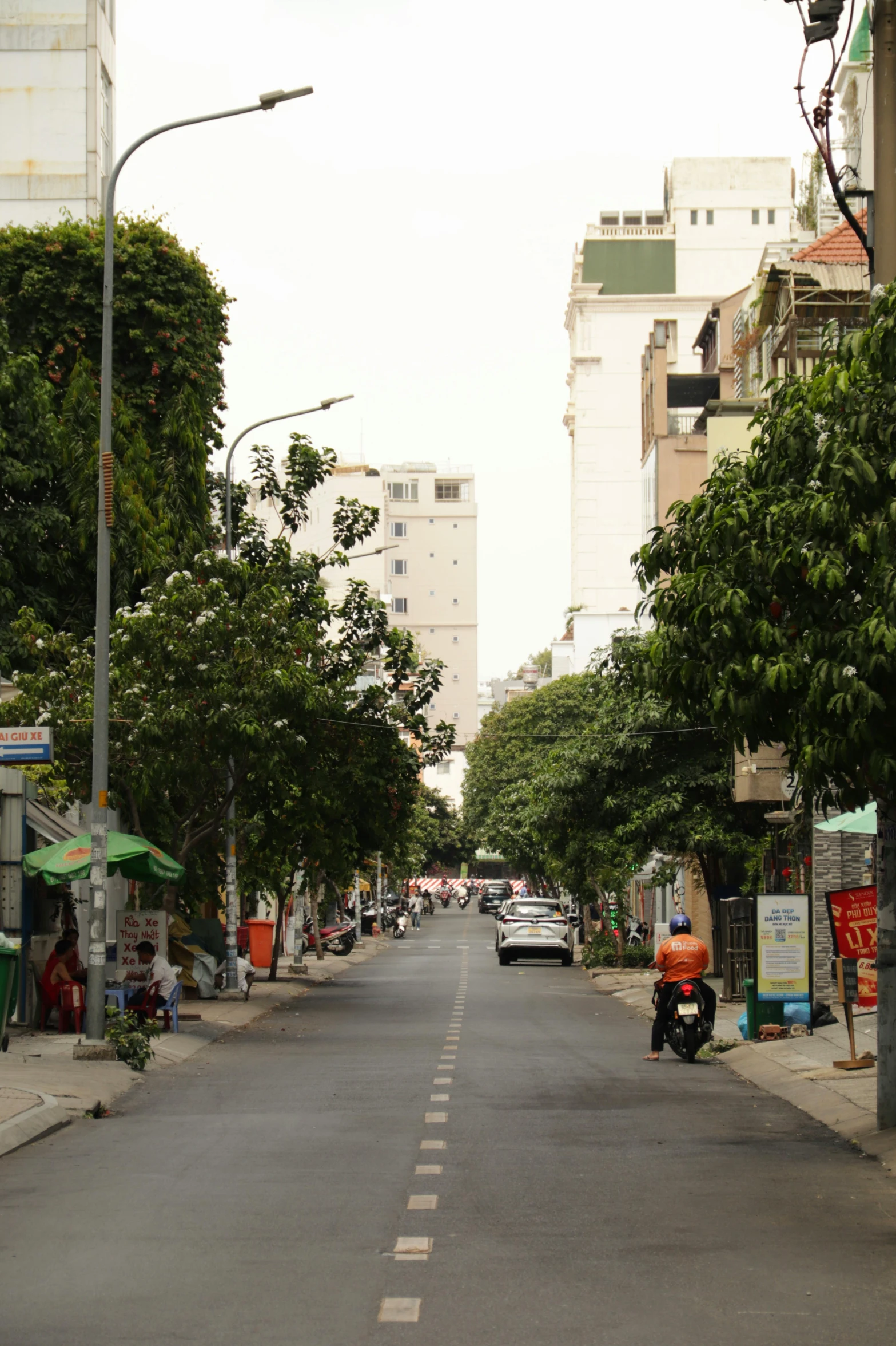 a car driving down the middle of an empty street