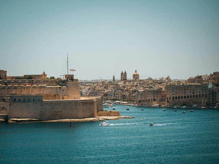 a view over a river of ships and buildings