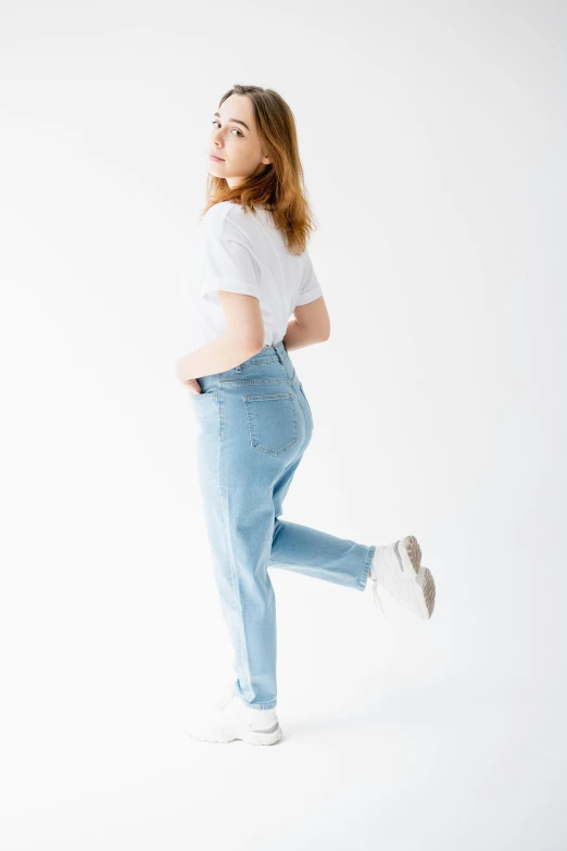 a girl is walking and wearing glasses