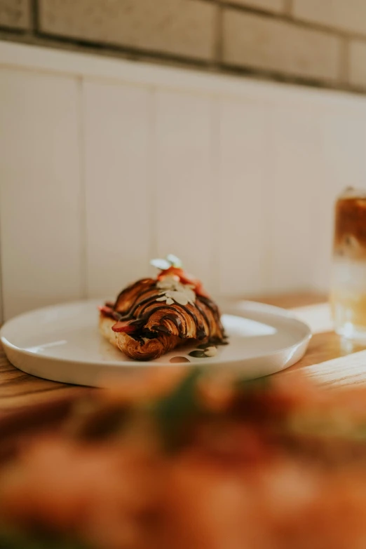 some food sitting on a white plate on a table