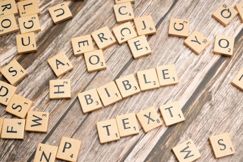 wooden letter spelling made up of wood scrabbles