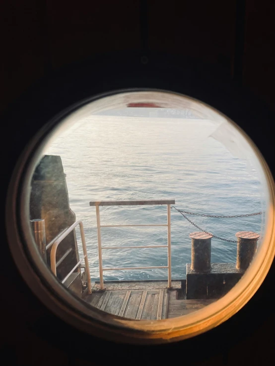 the view out of a small window in a ship