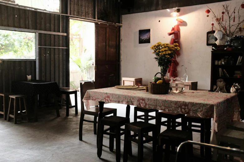 a dining table with a table cloth is in a room