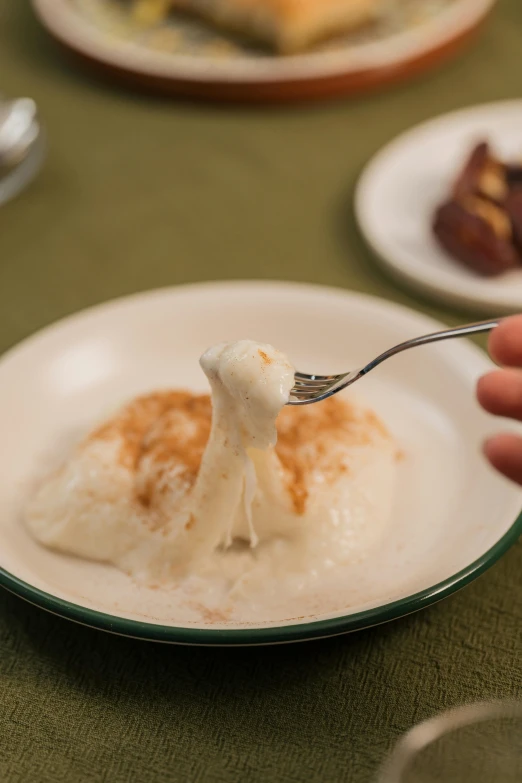 there is a small spoon on a white plate