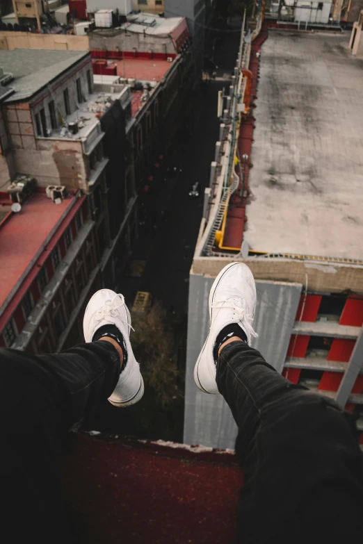 a man standing on the top of a tall building