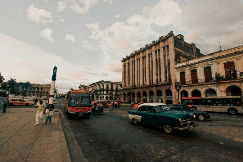 some cars and a bus on a street