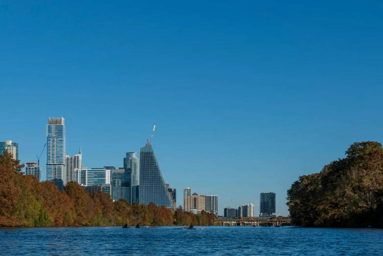 a boat on a river in front of some buildings