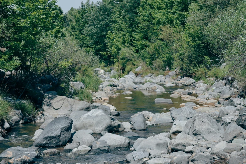 a stream flowing between two large rocks