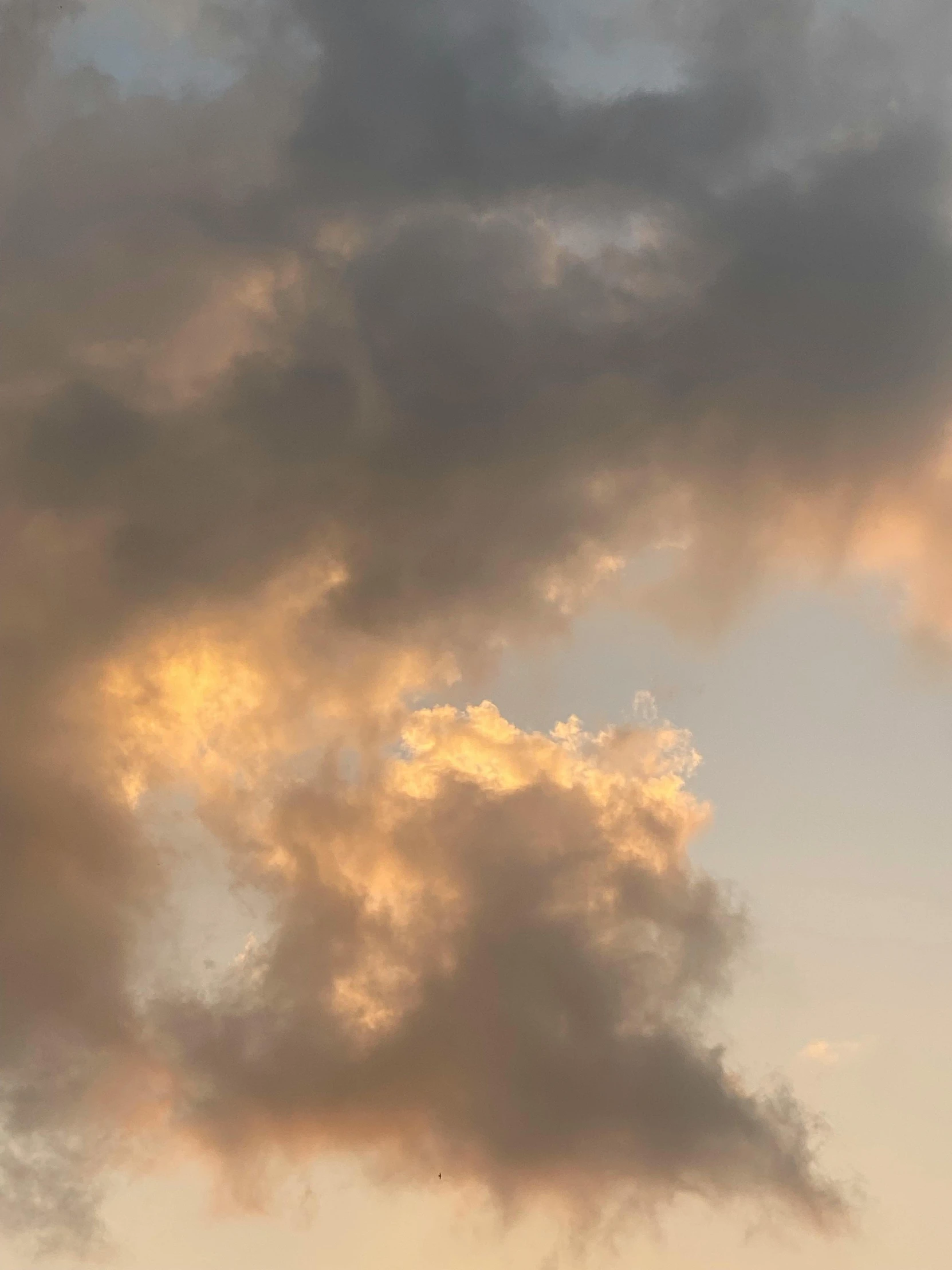 a lone plane flying in front of the sunset sky