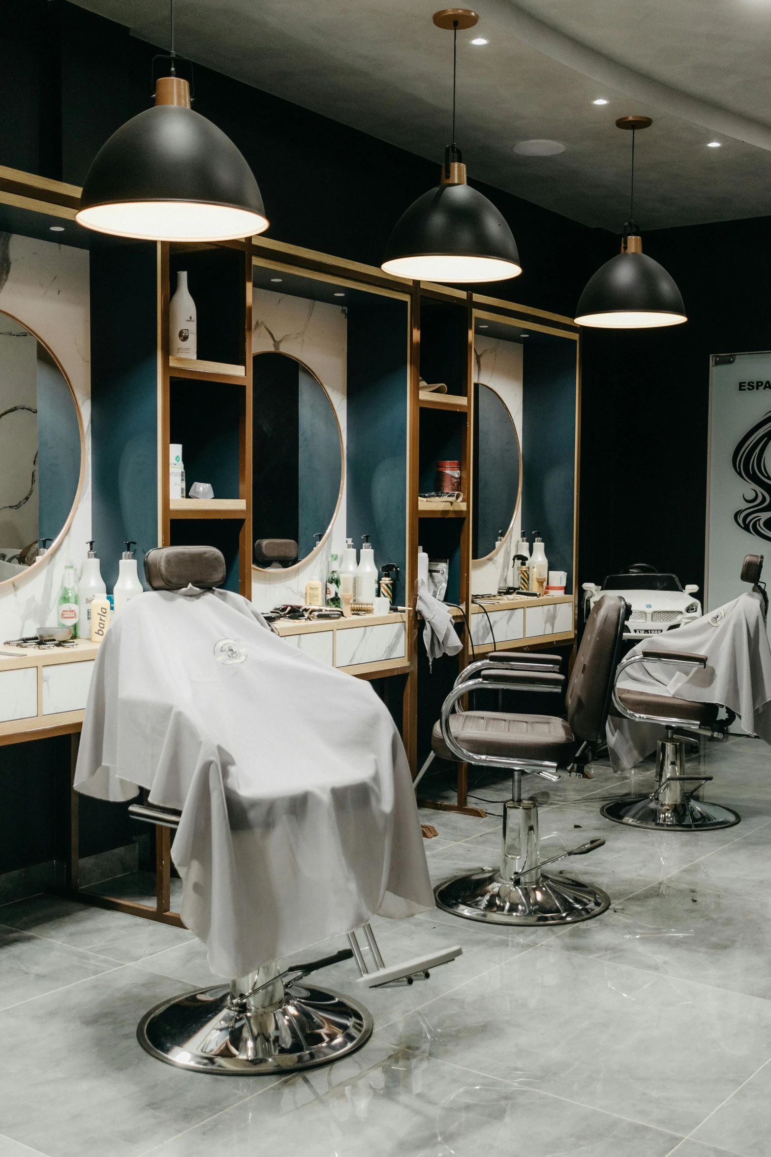 a hair salon is set up with black and white decor