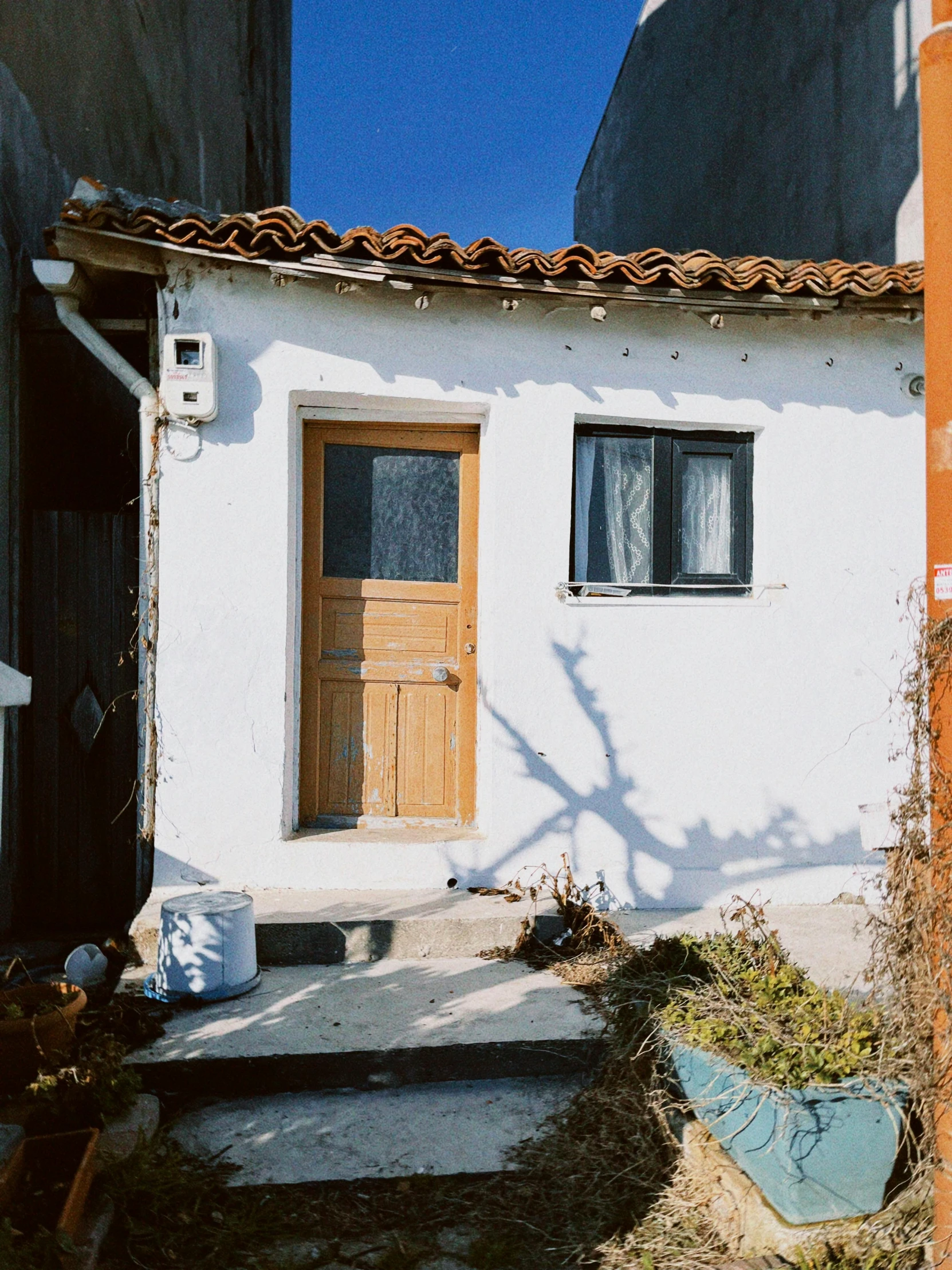 the front door of a white stucco building