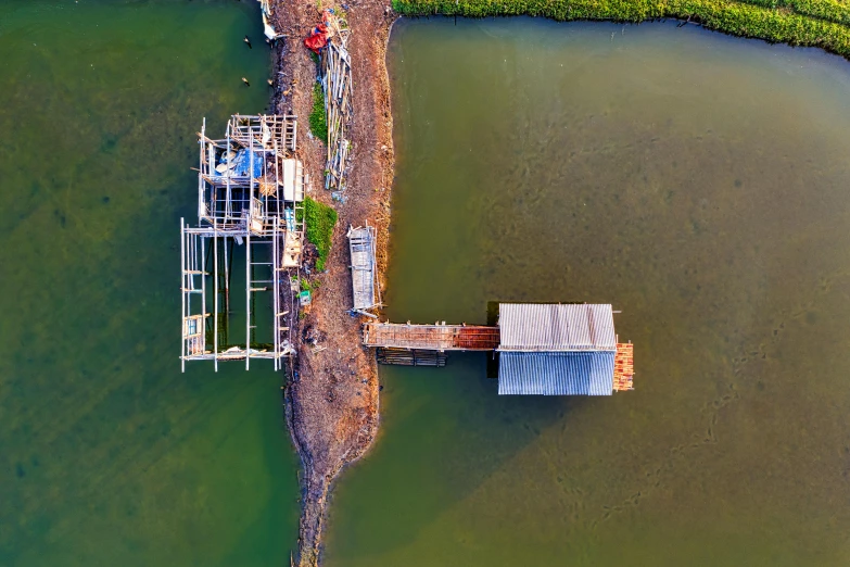 a view from above, of a dock and riverbank