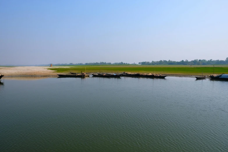 a number of small boats in a body of water