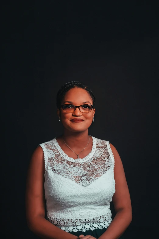 a woman standing with her arms folded