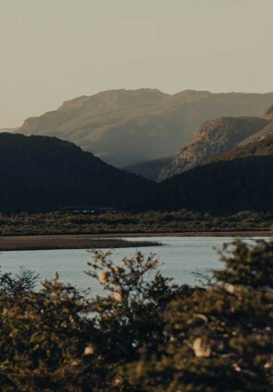 a body of water surrounded by mountains