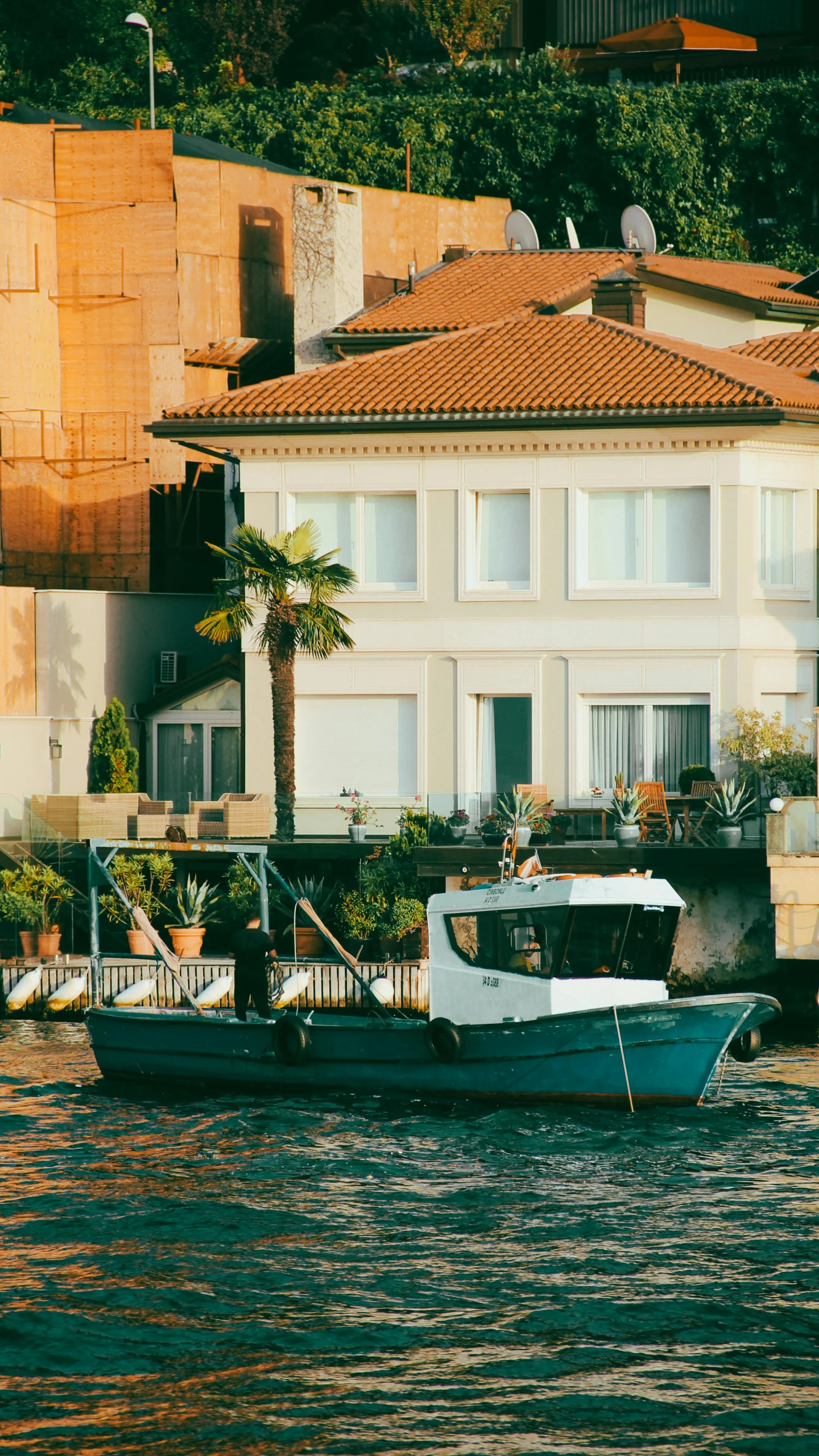 some white boats docked in front of houses