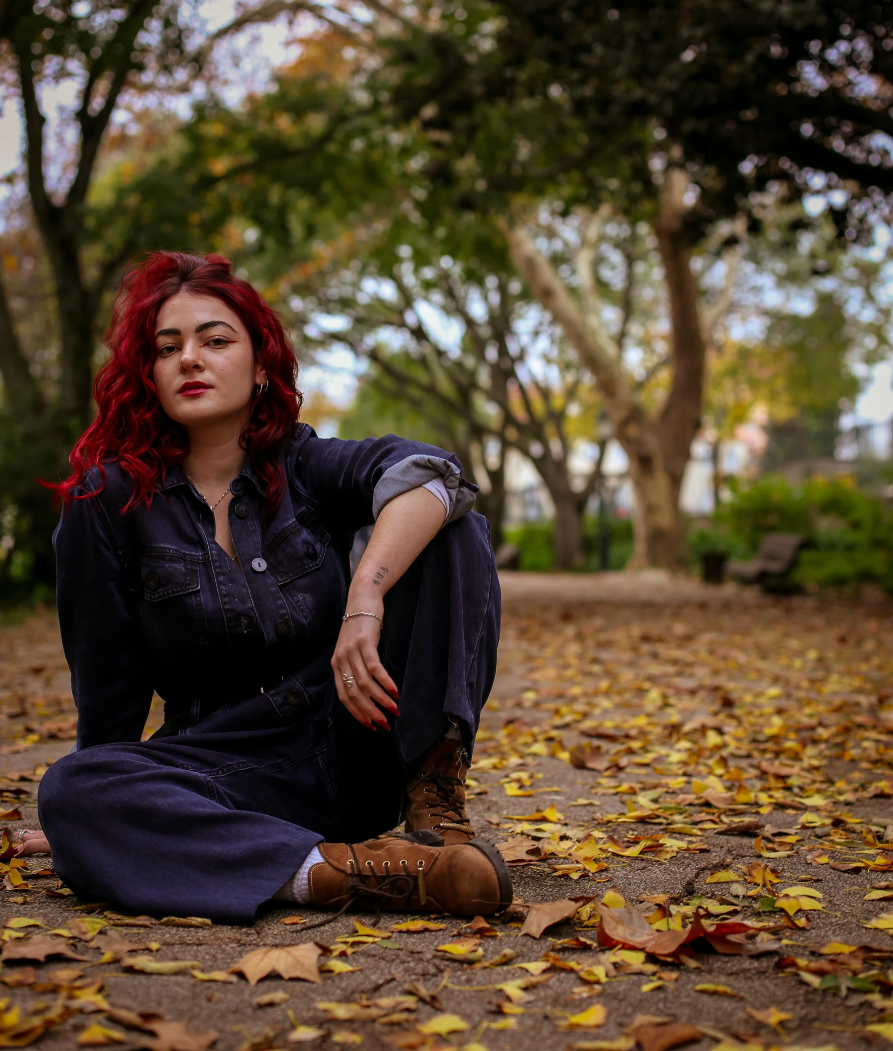 a woman sitting down on the ground