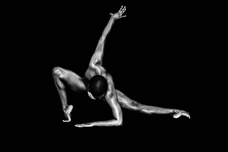 an artistic black and white image of a woman in a bikini, diving