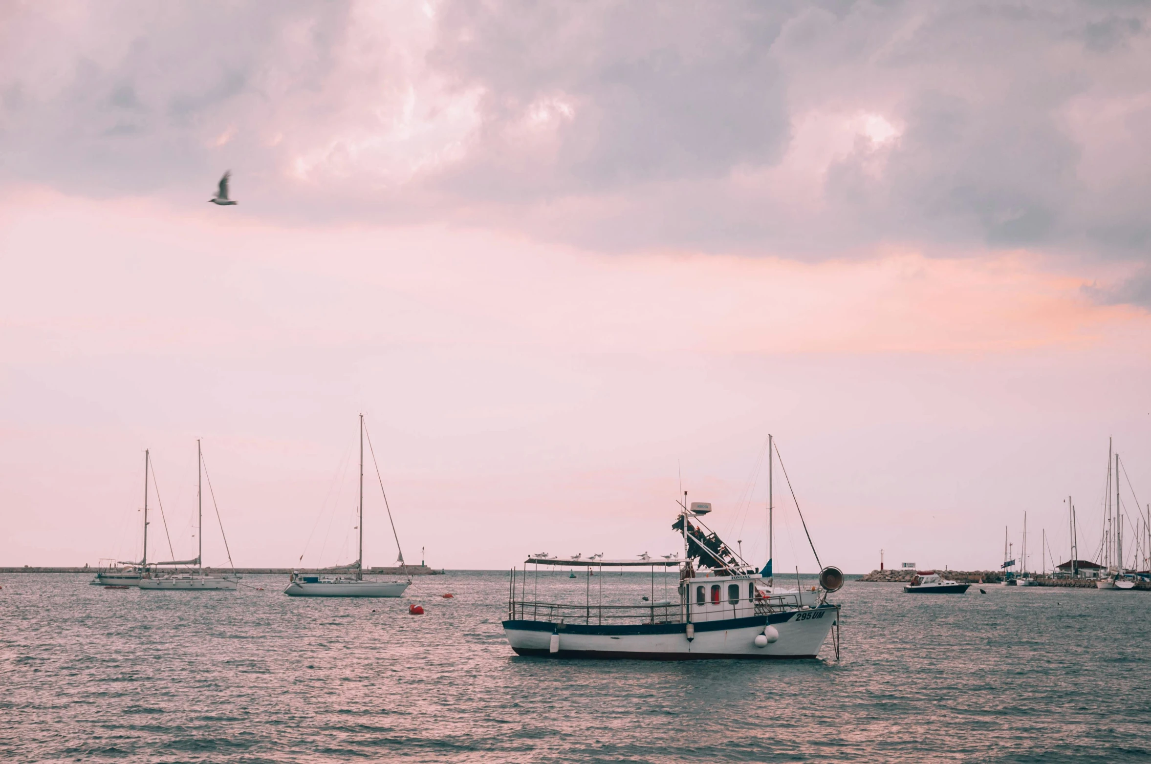 there are some boats floating on the water