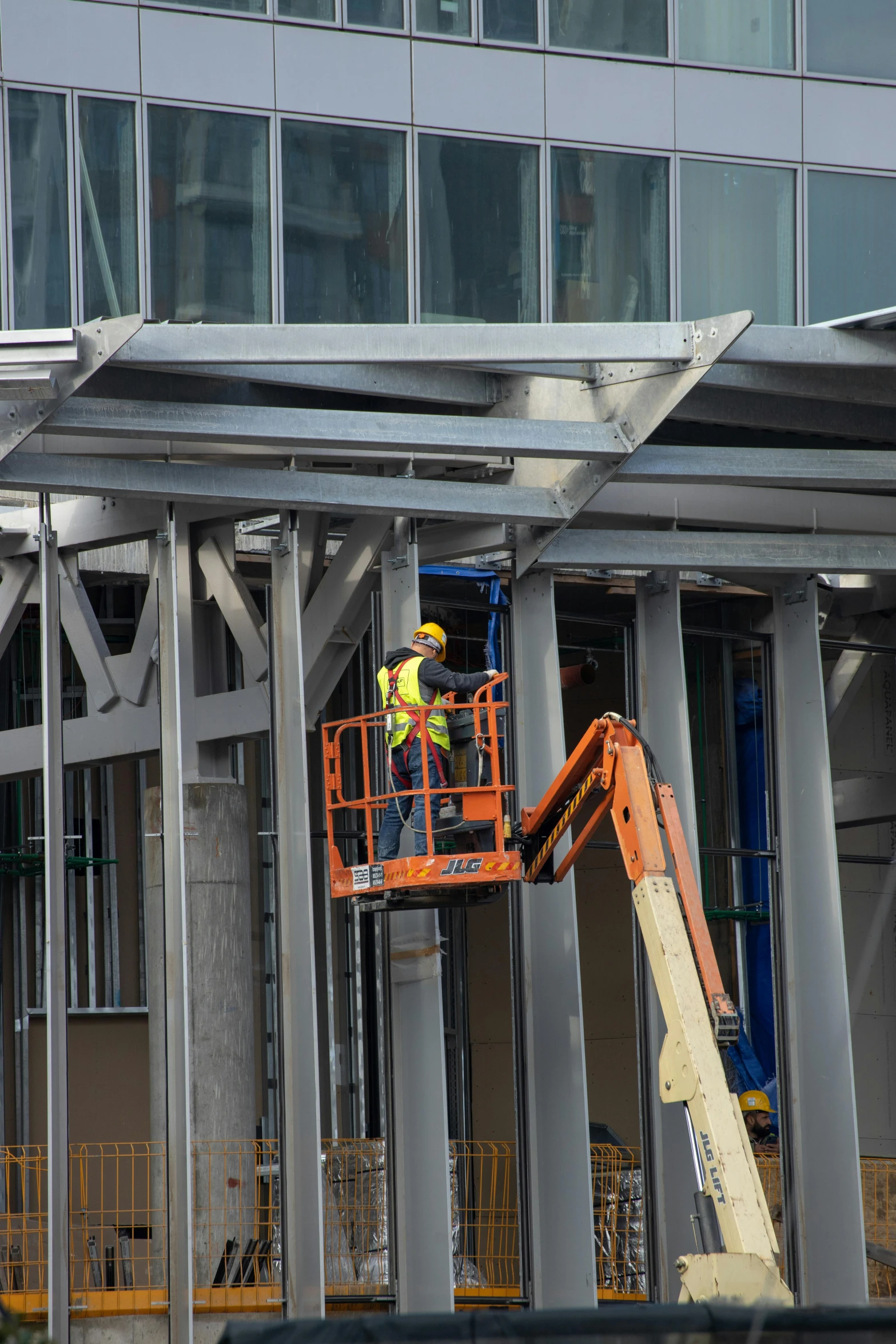 a large crane is working on the side of a building