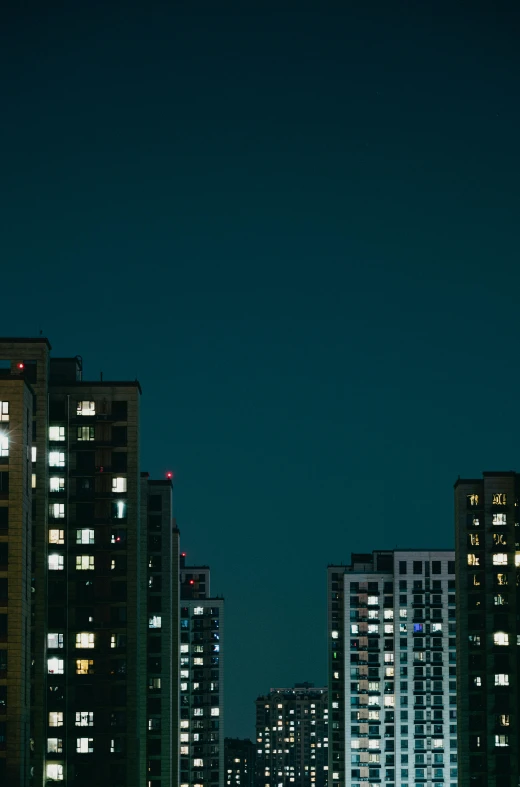 some very large buildings in the night sky