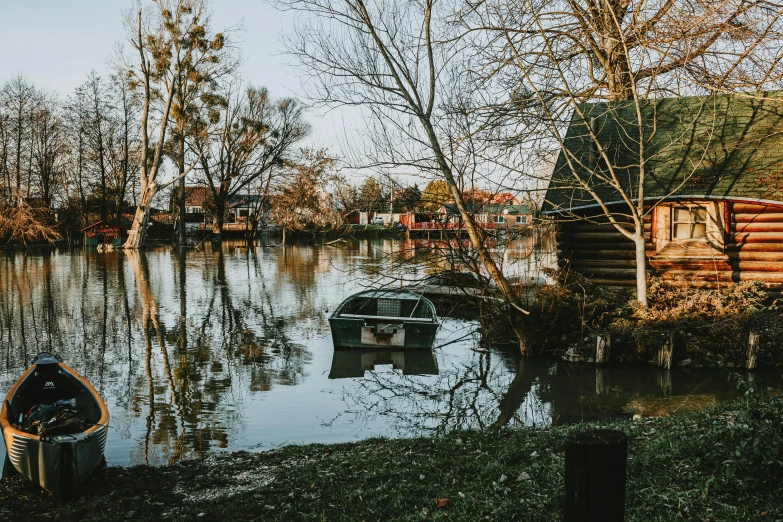 a canoe and small house are out on the water