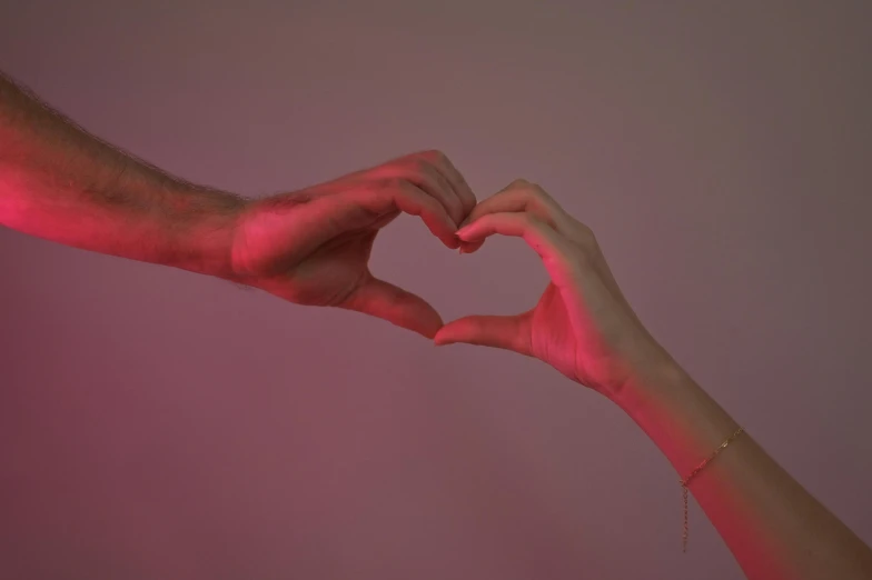 two hands in the shape of a heart