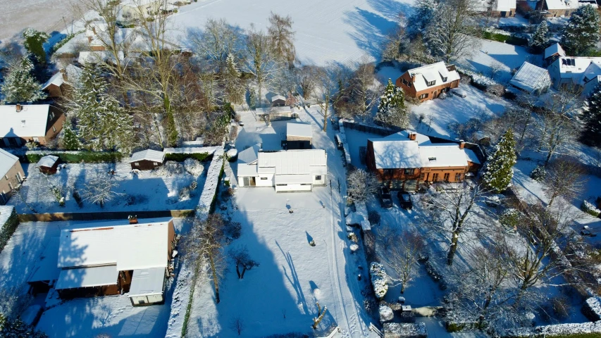 a view from above looking down at snowy houses