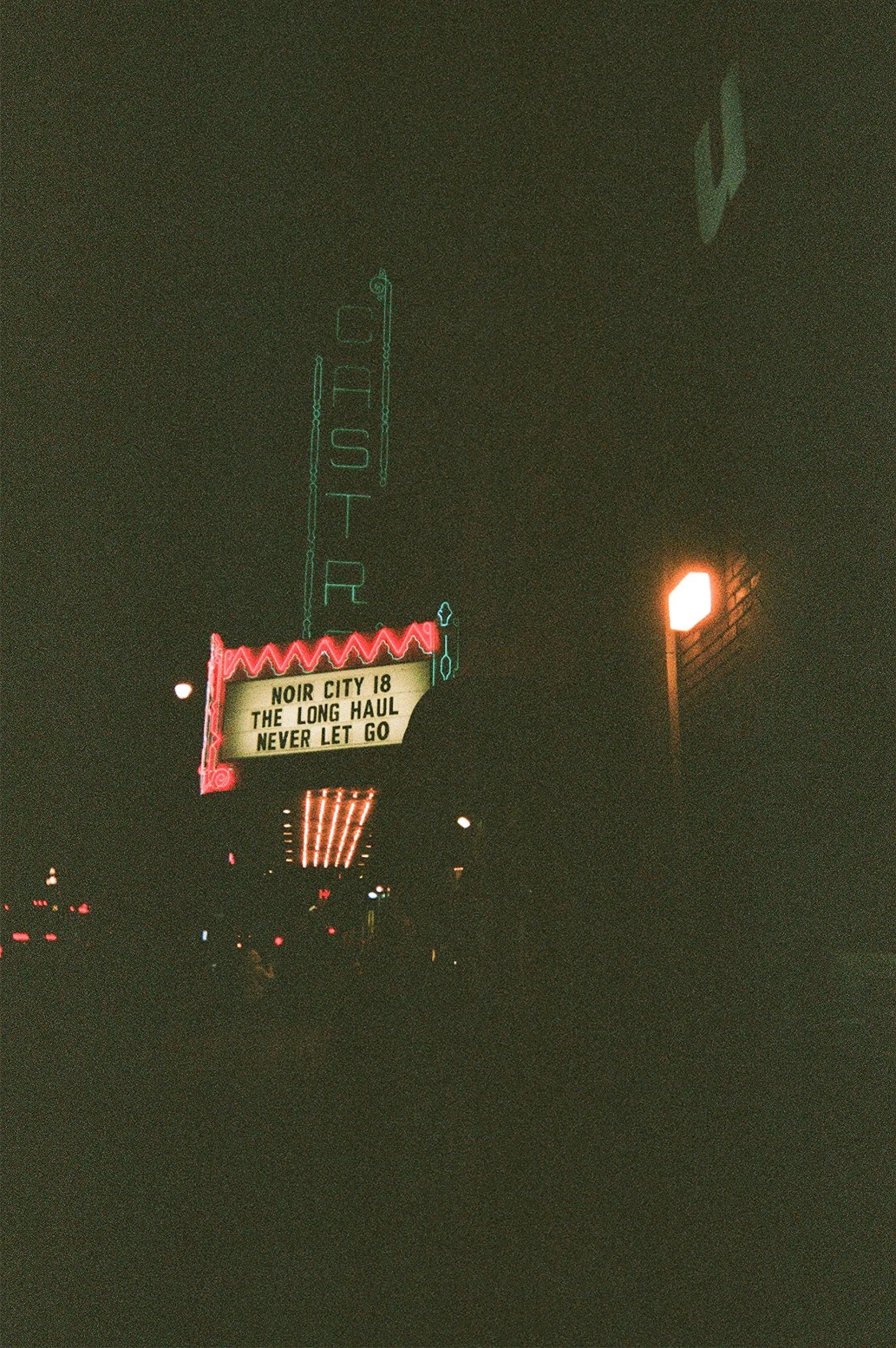 an old sign for a strip mall advertises neon sign