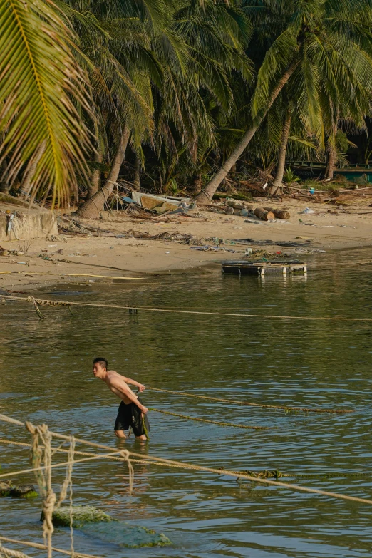 there is a man that is standing in the water