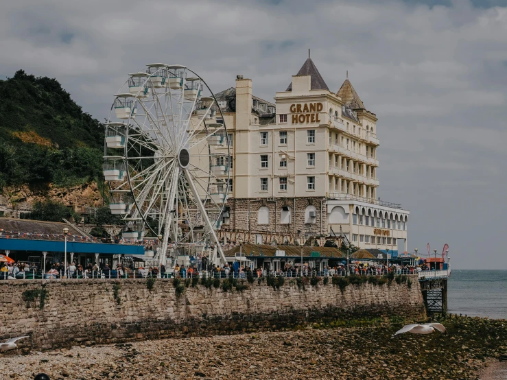 the ferris wheel has been placed near the building