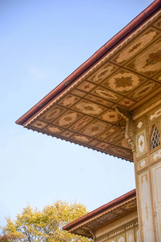 an ornate building with intricate architecture and trees in the background