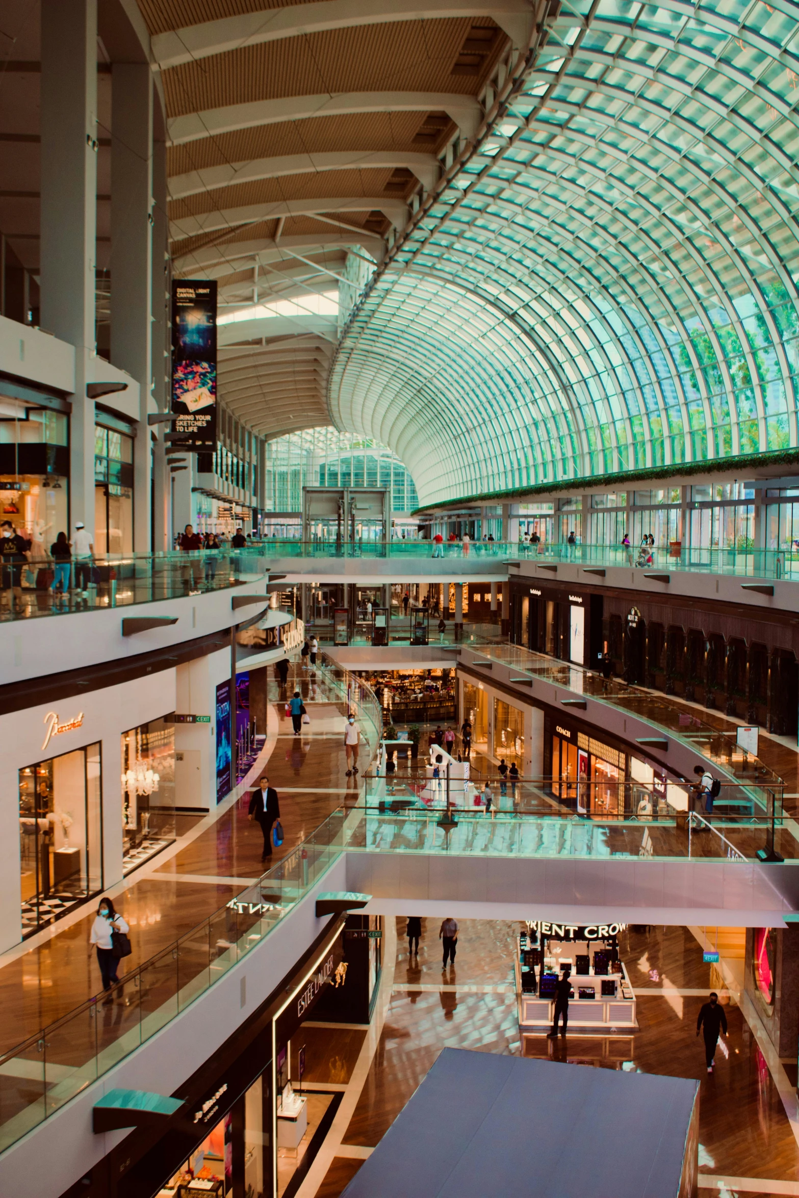 there is a mall with many people walking around it