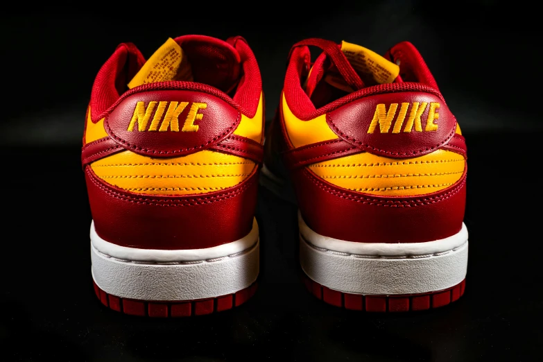 the nike dunk low red yellow and white color scheme