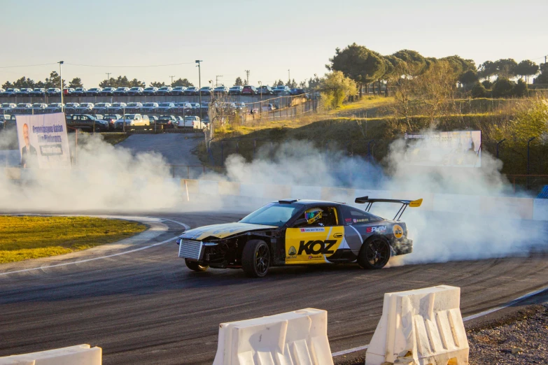 a car that is going around a track on a road