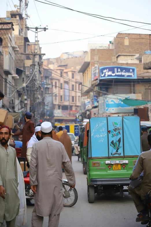 several men walking in the street with people around