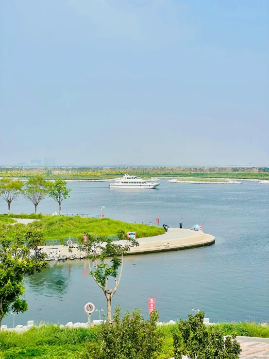 a body of water with boats in the background