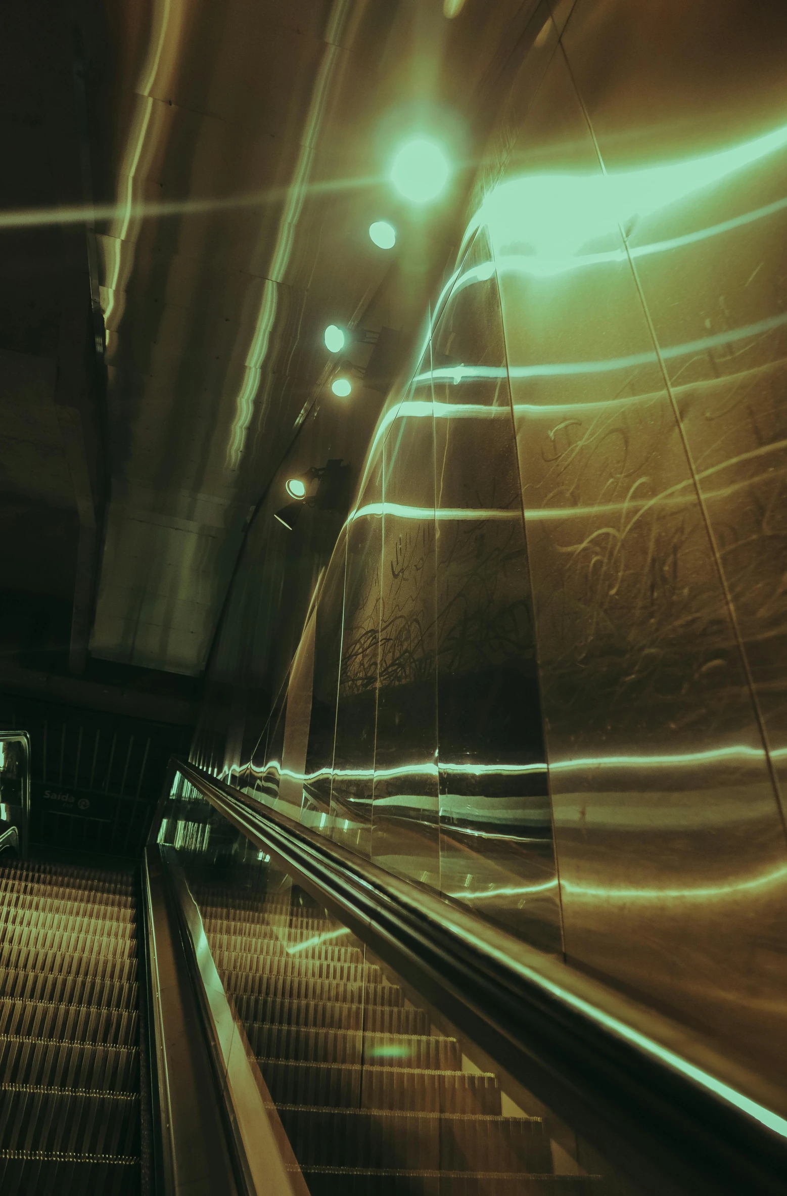 an escalator and some metal rails in a building