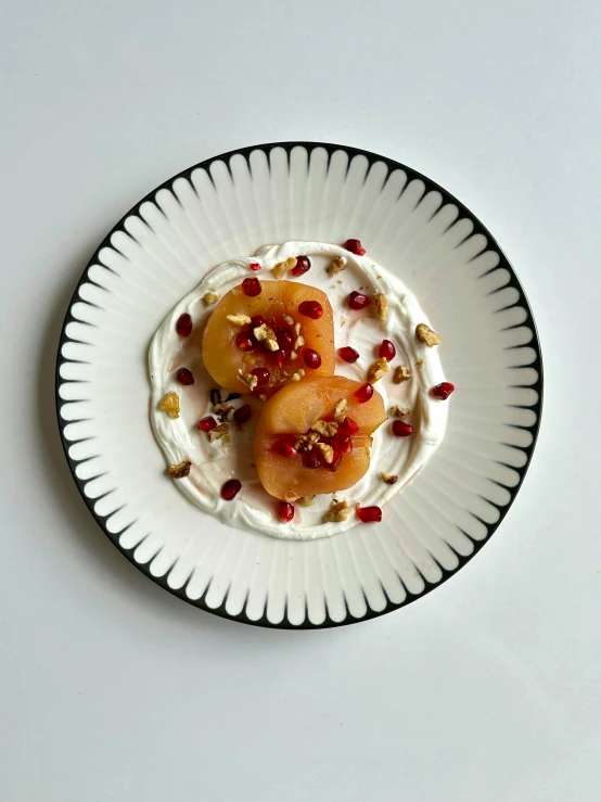 a plate with yogurt, peaches, and granola on it