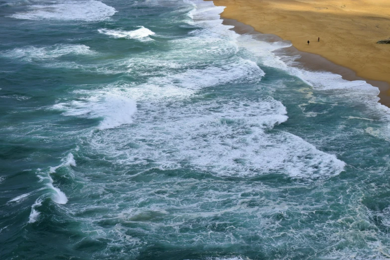 there is a beach with many people next to it