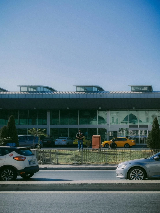 two cars are parked in front of a building