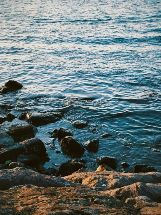 a person is standing on the edge of the cliff