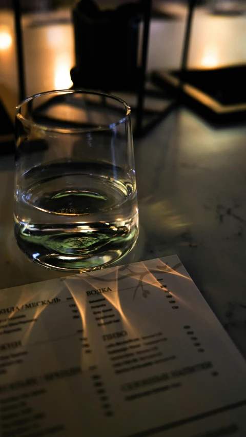 a glass of water on a restaurant table