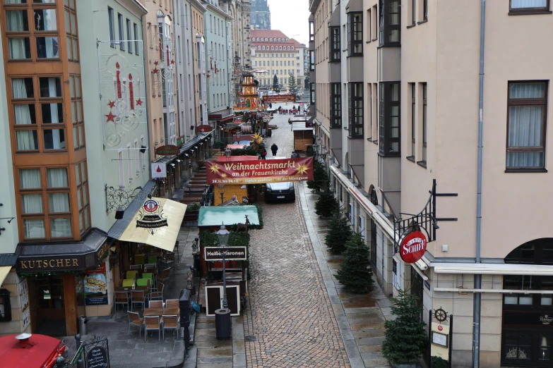 a street view with buildings and tables