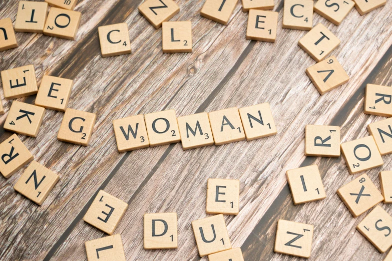 letters are spelled in wood with scrabble letters